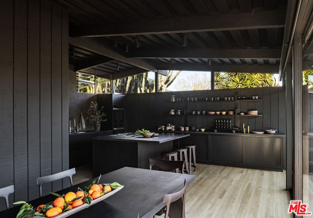 a view of a chairs and table in patio