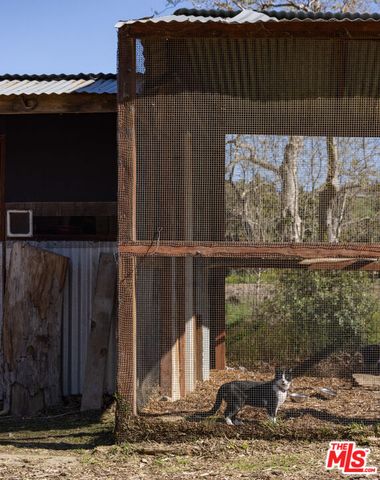 a view of a balcony with wooden floor