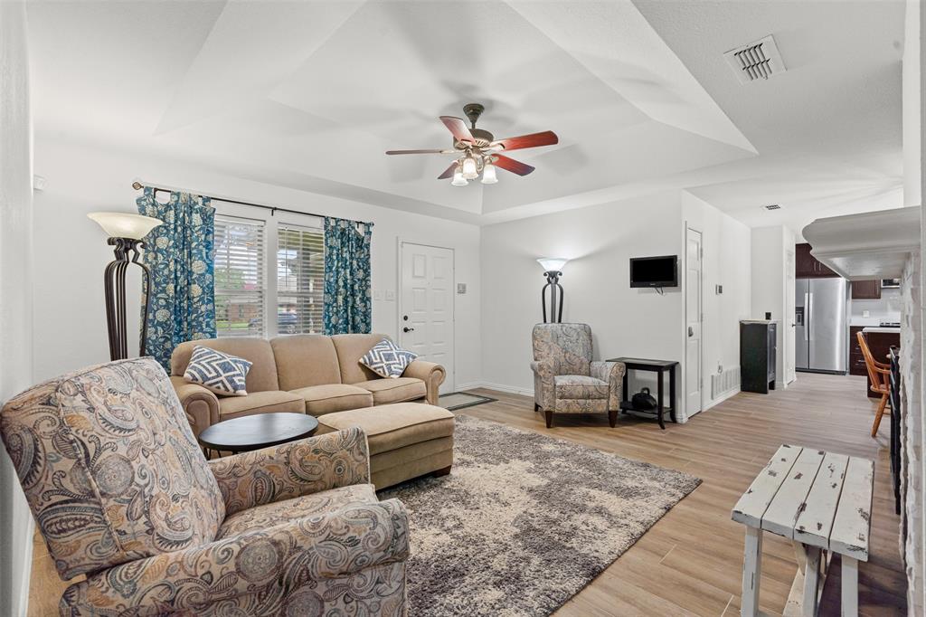 9013 Topperwind Court Fort Worth, TX 76134 - Photo 10 of 32 Living area with easy access to dining area