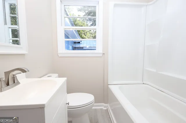 a bathroom with a sink and a toilet