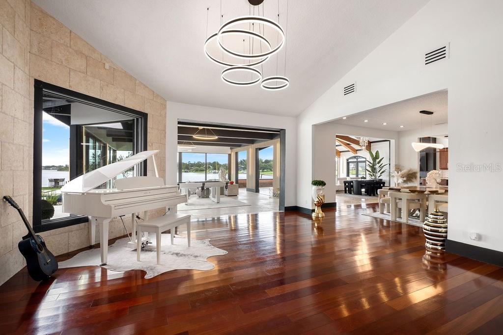 2844 Marquesas Court Windermere, FL 34786 - Photo 12 of 75 a view of living room filled with furniture and wooden floor