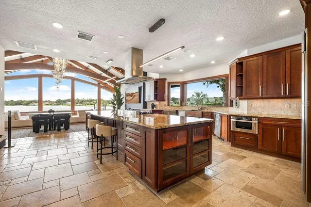 a spacious bedroom with a large bed and a large window