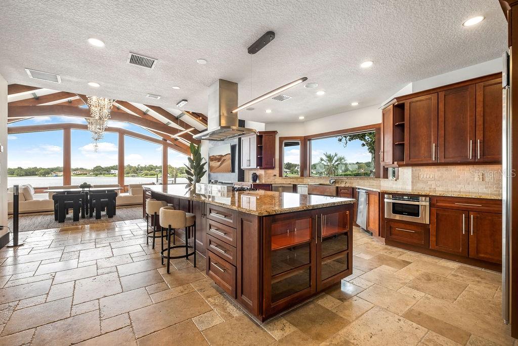 2844 Marquesas Court Windermere, FL 34786 - Photo 27 of 75 a kitchen with stainless steel appliances granite countertop a stove and a refrigerator