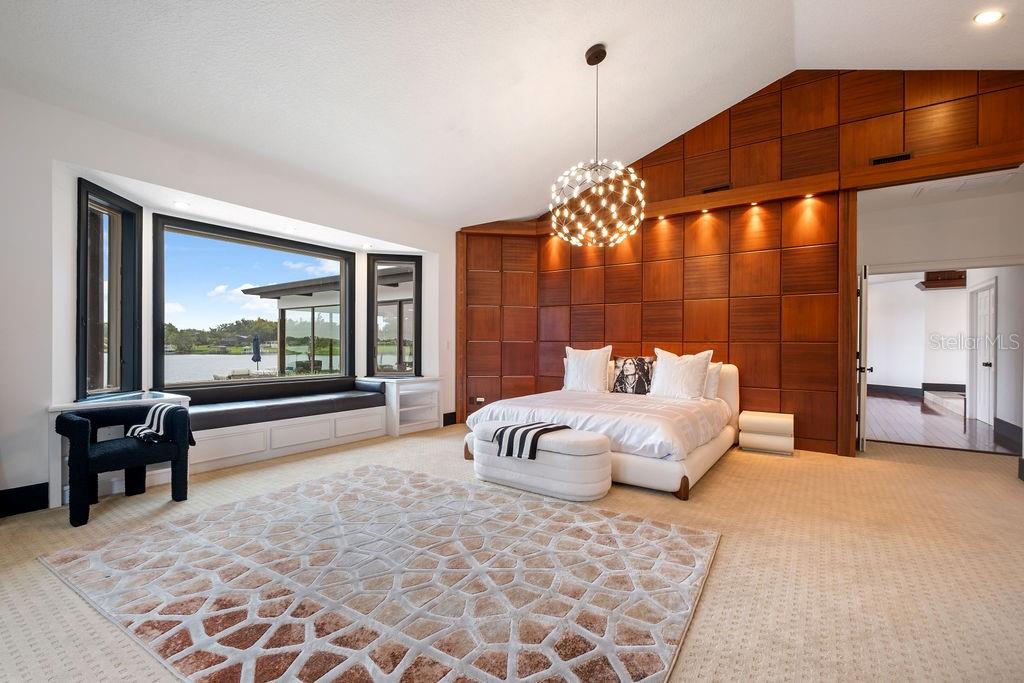 2844 Marquesas Court Windermere, FL 34786 - Photo 40 of 75 a spacious bedroom with a large bed and a large window