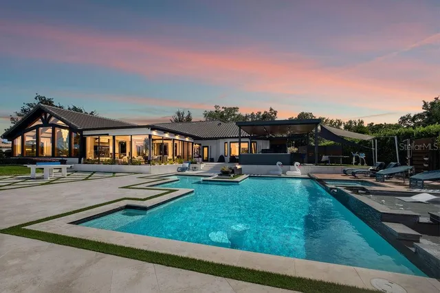 a view of a house with swimming pool