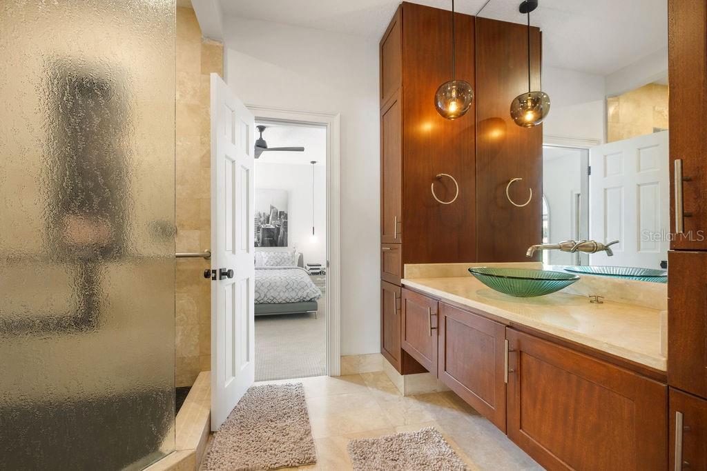 2844 Marquesas Court Windermere, FL 34786 - Photo 49 of 75 a bathroom with a granite countertop sink and a mirror