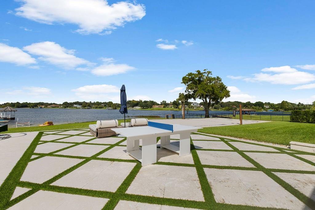 2844 Marquesas Court Windermere, FL 34786 - Photo 57 of 75 a view of swimming pool with seating area and hardwood floor