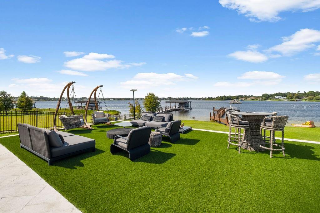 2844 Marquesas Court Windermere, FL 34786 - Photo 65 of 75 a view of a garden with couches chairs and swimming pool