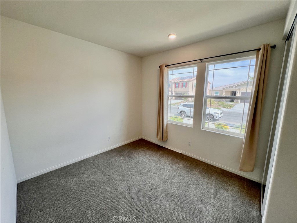 19549 Sunkissed Rdg Drive Riverside, CA 92507 - Photo 11 of 17 an empty room with windows