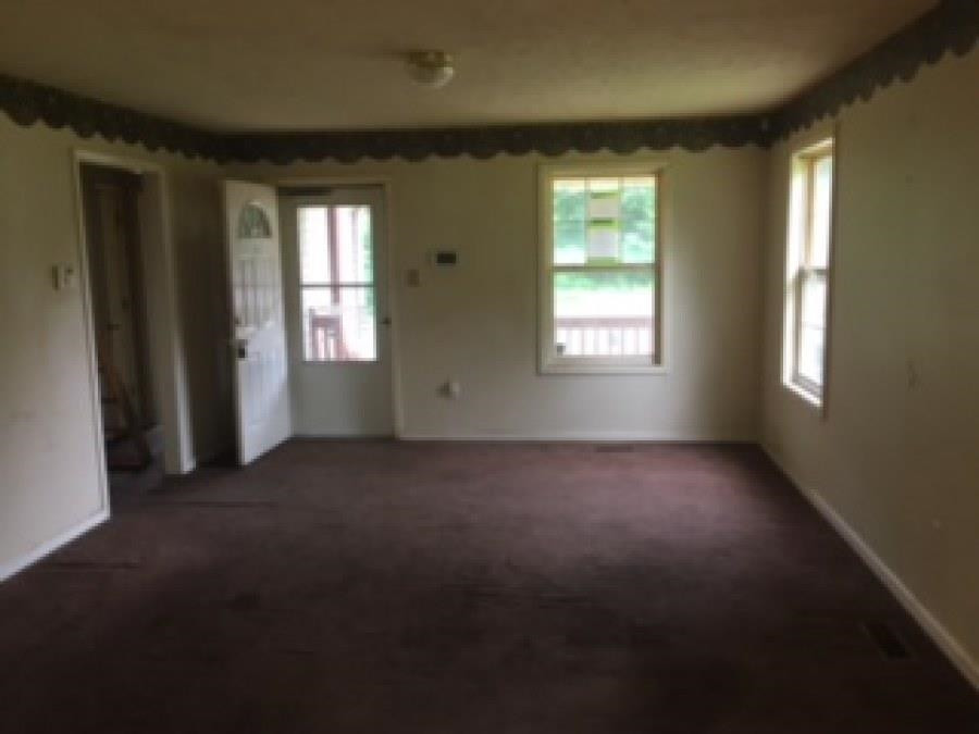 122 Booker Street Jackson, TN 38301 - Photo 13 of 18 a view of empty room with windows