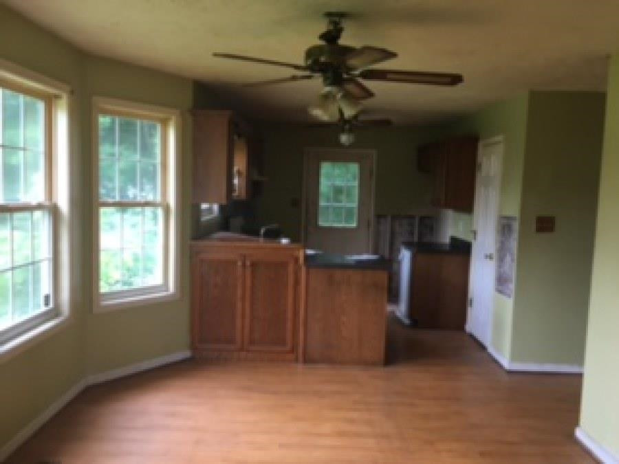 122 Booker Street Jackson, TN 38301 - Photo 14 of 18 wooden floor in an empty room with a window