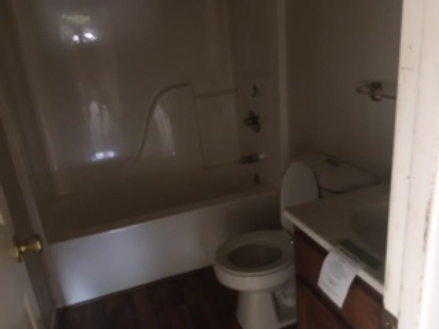122 Booker Street Jackson, TN 38301 - Photo 15 of 18 a bathroom with a toilet