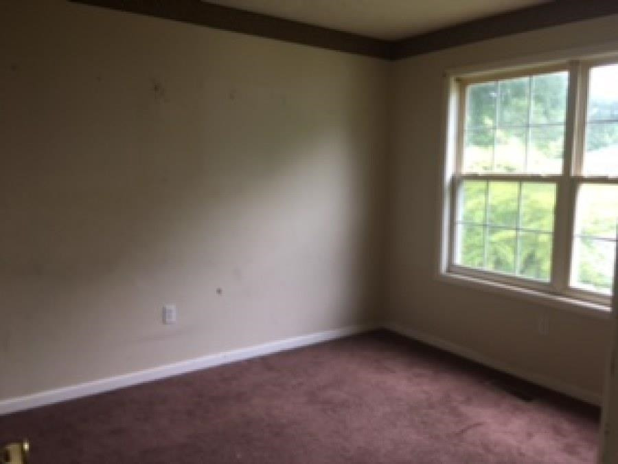 122 Booker Street Jackson, TN 38301 - Photo 16 of 18 an empty room with a window