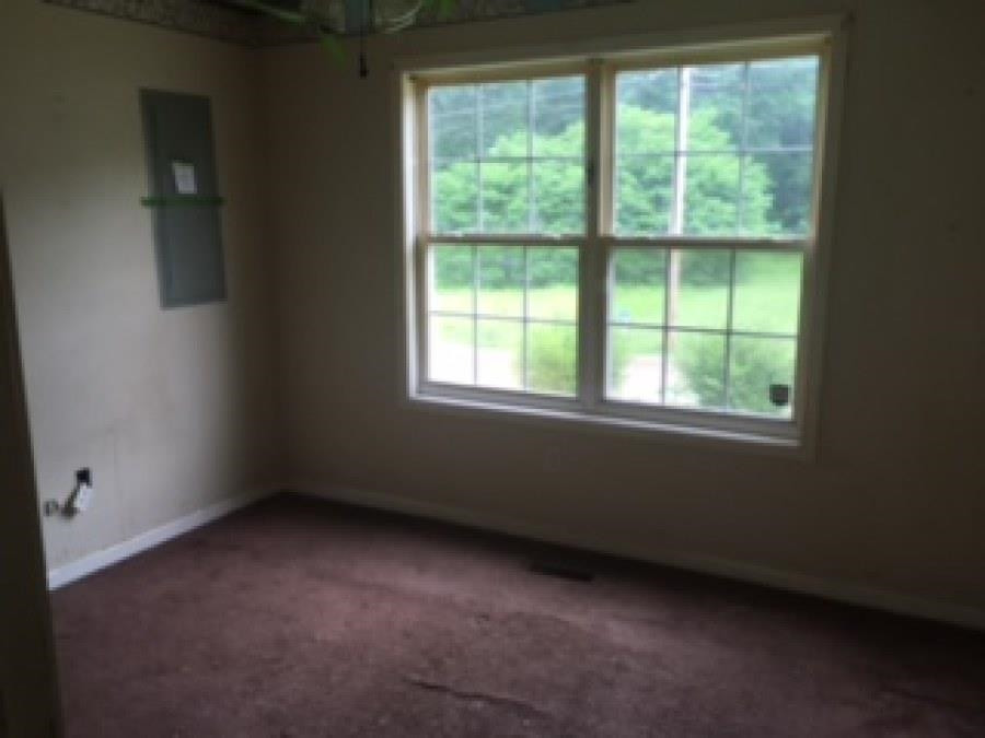 122 Booker Street Jackson, TN 38301 - Photo 17 of 18 an empty room with a window