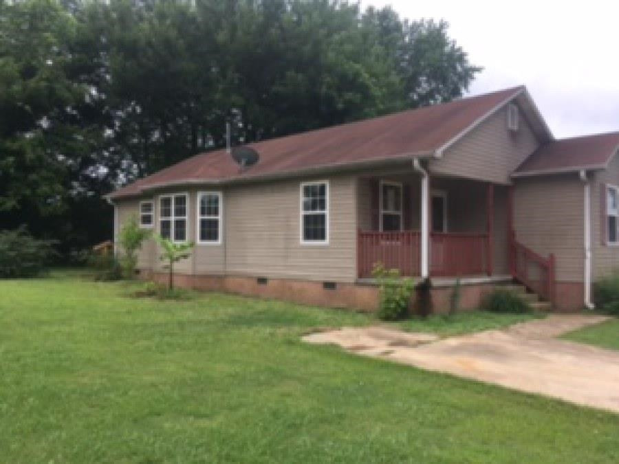 122 Booker Street Jackson, TN 38301 - Photo 2 of 18 a view of a house with a yard