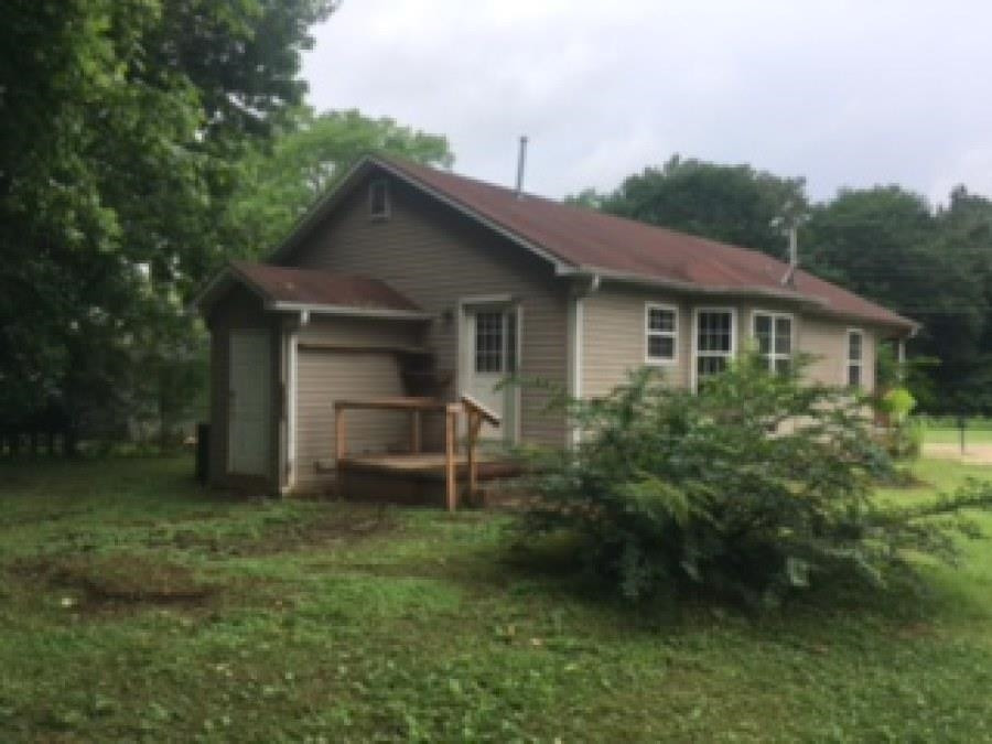 122 Booker Street Jackson, TN 38301 - Photo 3 of 18 a house view with a garden space