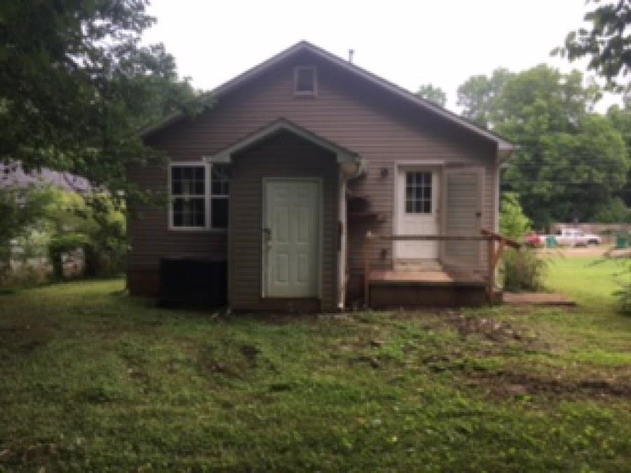 122 Booker Street Jackson, TN 38301 - Photo 4 of 18 a view of a house with a yard
