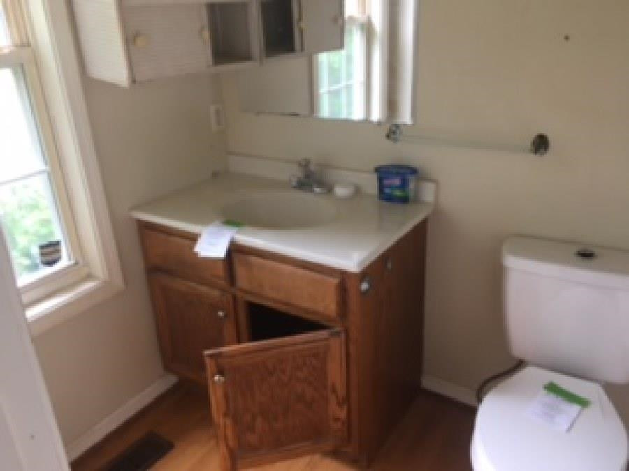 122 Booker Street Jackson, TN 38301 - Photo 7 of 18 a bathroom with a sink toilet and window