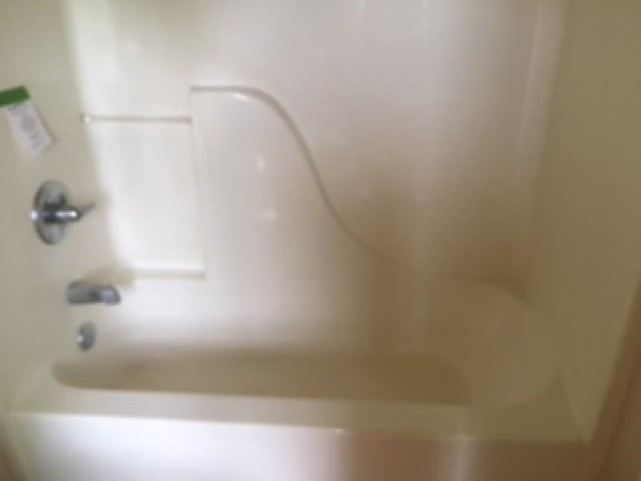 122 Booker Street Jackson, TN 38301 - Photo 8 of 18 a close up of a bathtub