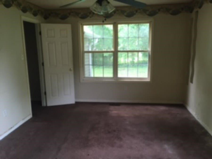 122 Booker Street Jackson, TN 38301 - Photo 9 of 18 an empty room with a window