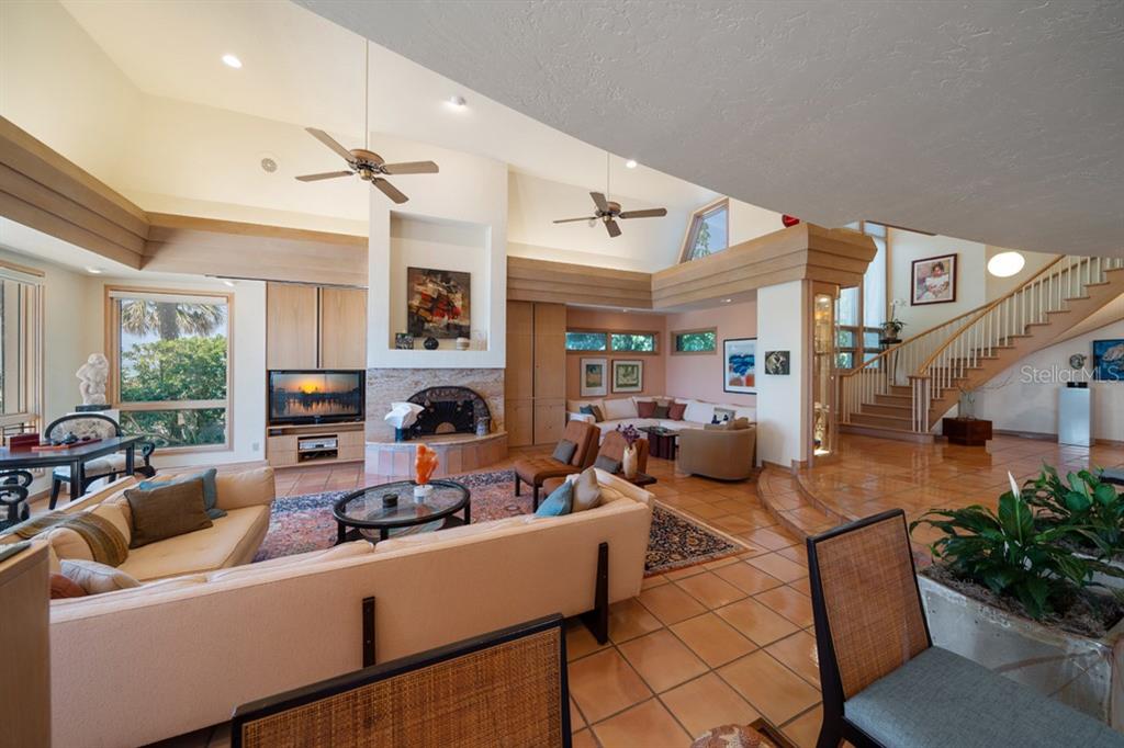 16000 Gulf Boulevard Redington Beach, FL 33708 - Photo 11 of 47 a living room with furniture kitchen view and a large window