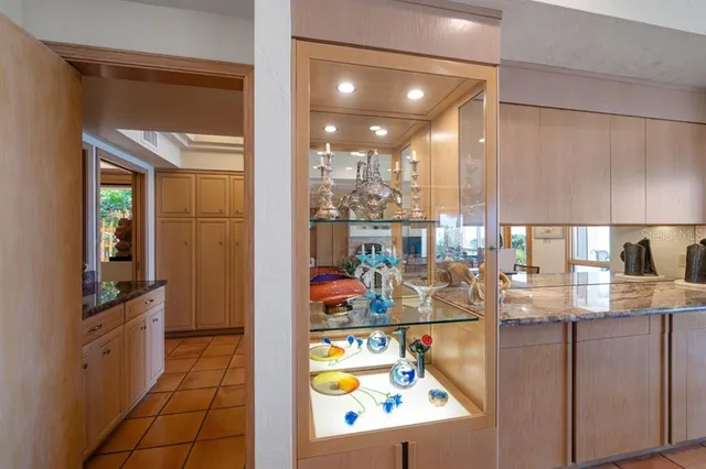 a kitchen with stainless steel appliances granite countertop a refrigerator and a stove