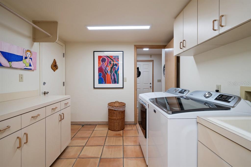 16000 Gulf Boulevard Redington Beach, FL 33708 - Photo 22 of 47 a kitchen that has a sink and a stove in it