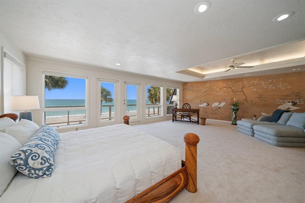 16000 Gulf Boulevard Redington Beach, FL 33708 - Photo 29 of 47 a bedroom with furniture and a flat screen tv