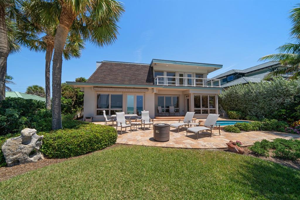 16000 Gulf Boulevard Redington Beach, FL 33708 - Photo 38 of 47 a front view of a house with garden and sitting area