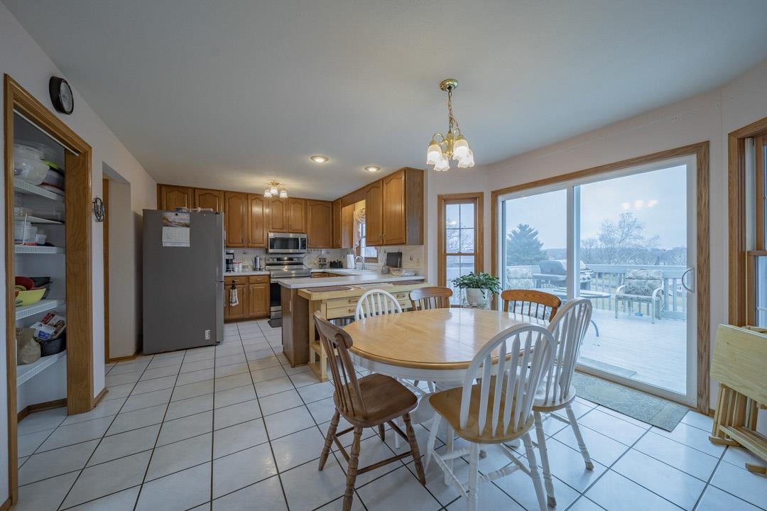 1982 Southgate Drive Lake Summerset, IL 61019 - Photo 16 of 33 a dining room with furniture a chandelier and kitchen view