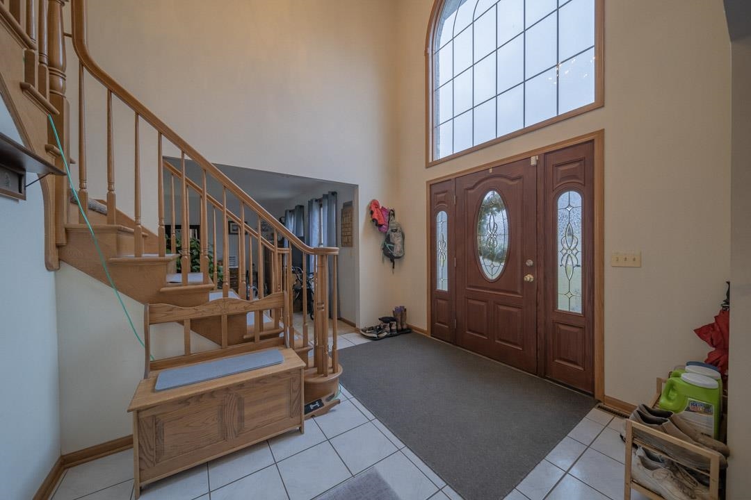 1982 Southgate Drive Lake Summerset, IL 61019 - Photo 25 of 33 a view of staircase with lots of frames on wall and a potted plant