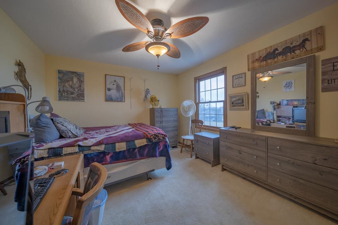 1982 Southgate Drive Lake Summerset, IL 61019 - Photo 30 of 33 a bed room with a bed and a chandelier