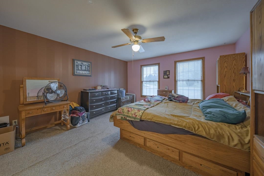 1982 Southgate Drive Lake Summerset, IL 61019 - Photo 8 of 33 a bedroom with a bed and a chandelier