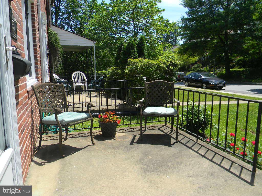 3923 Rexmere Road Baltimore, MD 21218 - Photo 2 of 21 a view of a chairs and table in the balcony