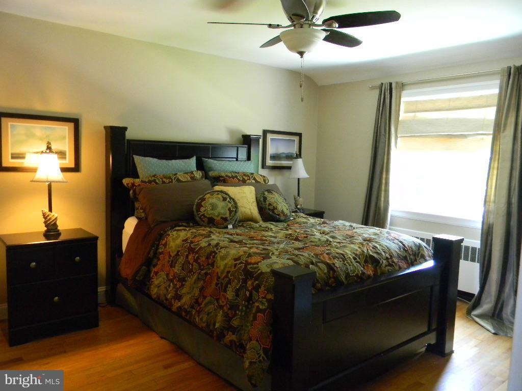3923 Rexmere Road Baltimore, MD 21218 - Photo 11 of 21 a bedroom with a bed and window