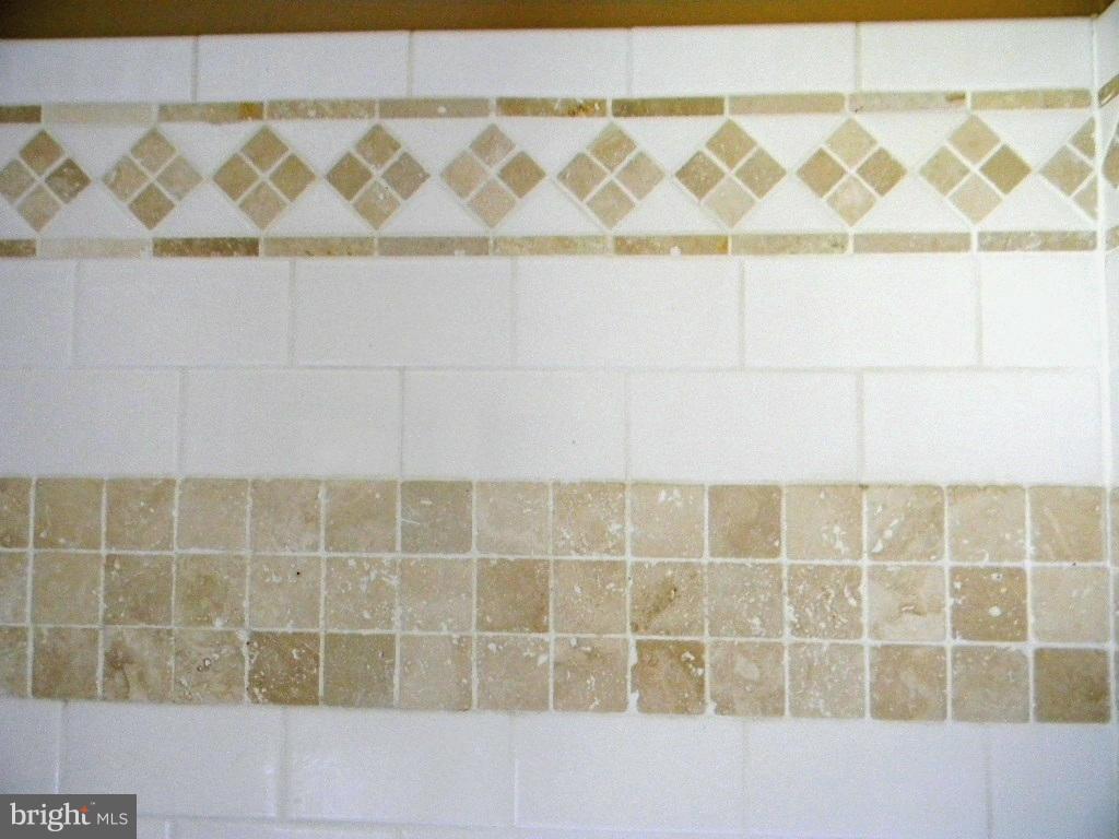 3923 Rexmere Road Baltimore, MD 21218 - Photo 13 of 21 a bathroom with a sink and a shower curtain
