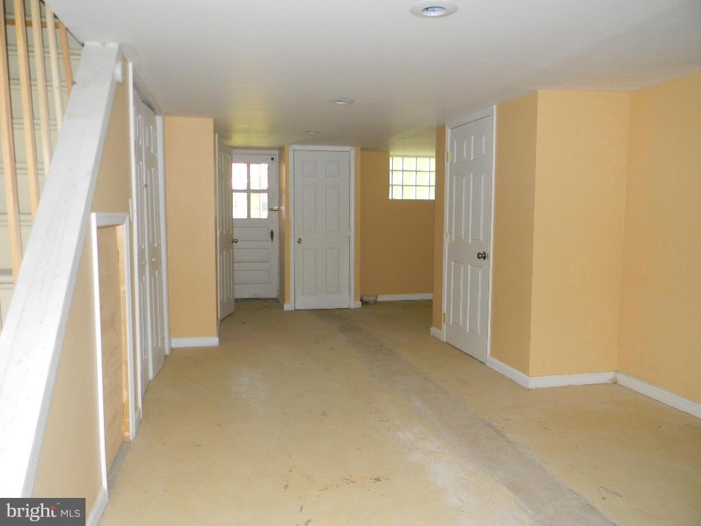 3923 Rexmere Road Baltimore, MD 21218 - Photo 16 of 21 a view of entryway with window and wooden floor