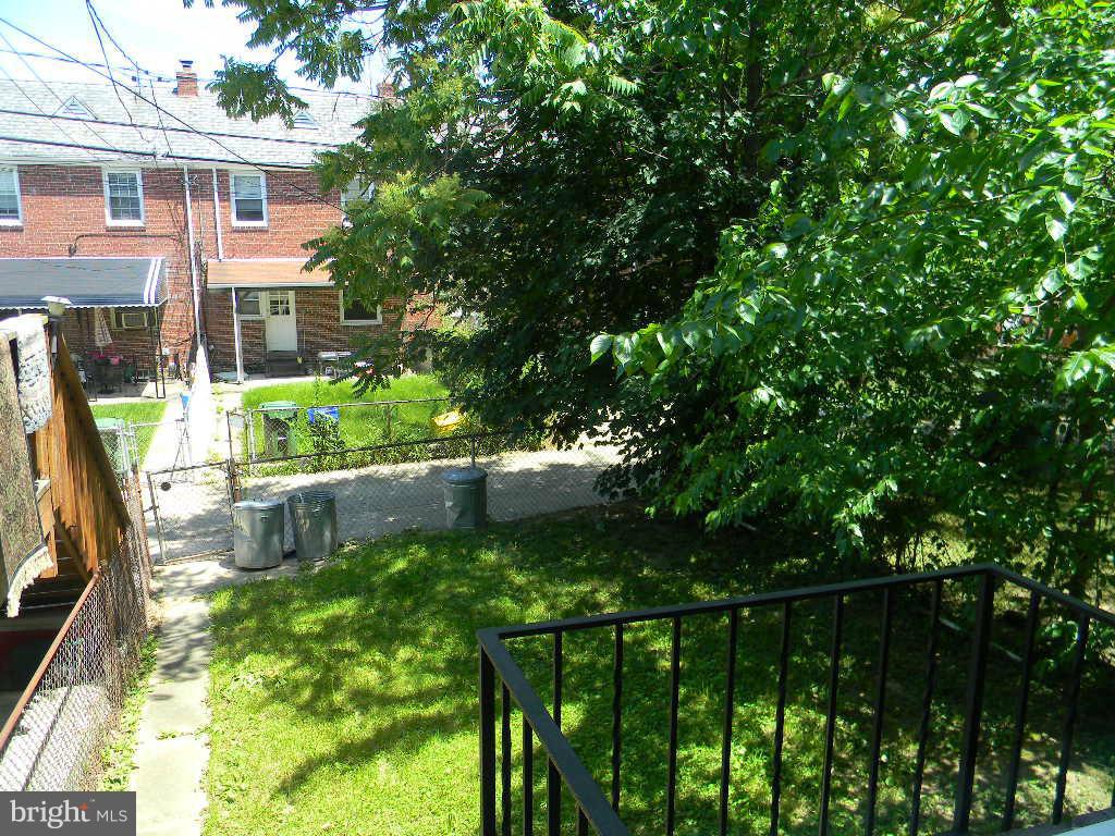 3923 Rexmere Road Baltimore, MD 21218 - Photo 18 of 21 a backyard of a house with lots of green space and plants