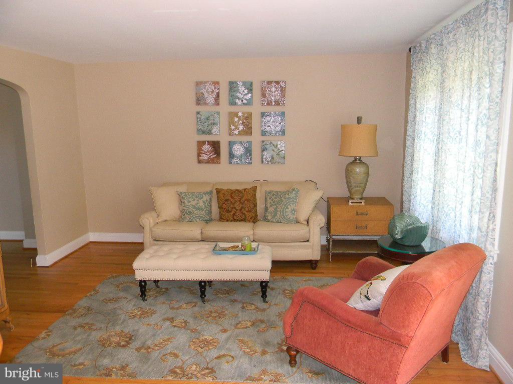 3923 Rexmere Road Baltimore, MD 21218 - Photo 3 of 21 a living room with furniture a rug and a window