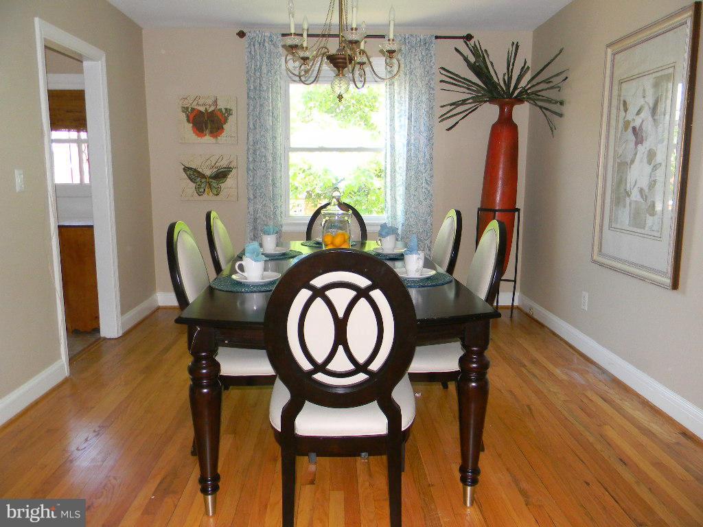 3923 Rexmere Road Baltimore, MD 21218 - Photo 4 of 21 a view of a dining room with furniture window and wooden floor