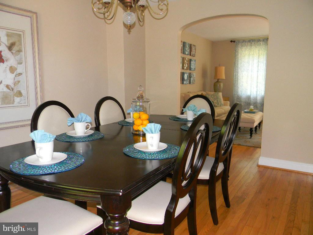 3923 Rexmere Road Baltimore, MD 21218 - Photo 5 of 21 a dining room with furniture and wooden floor