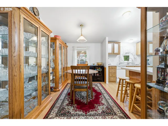 a living room with furniture flat screen tv and a large window