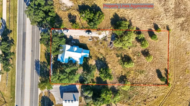 a spacious bedroom with a large bed and large windows