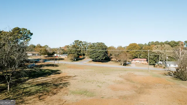 a view of a road with a building in the background