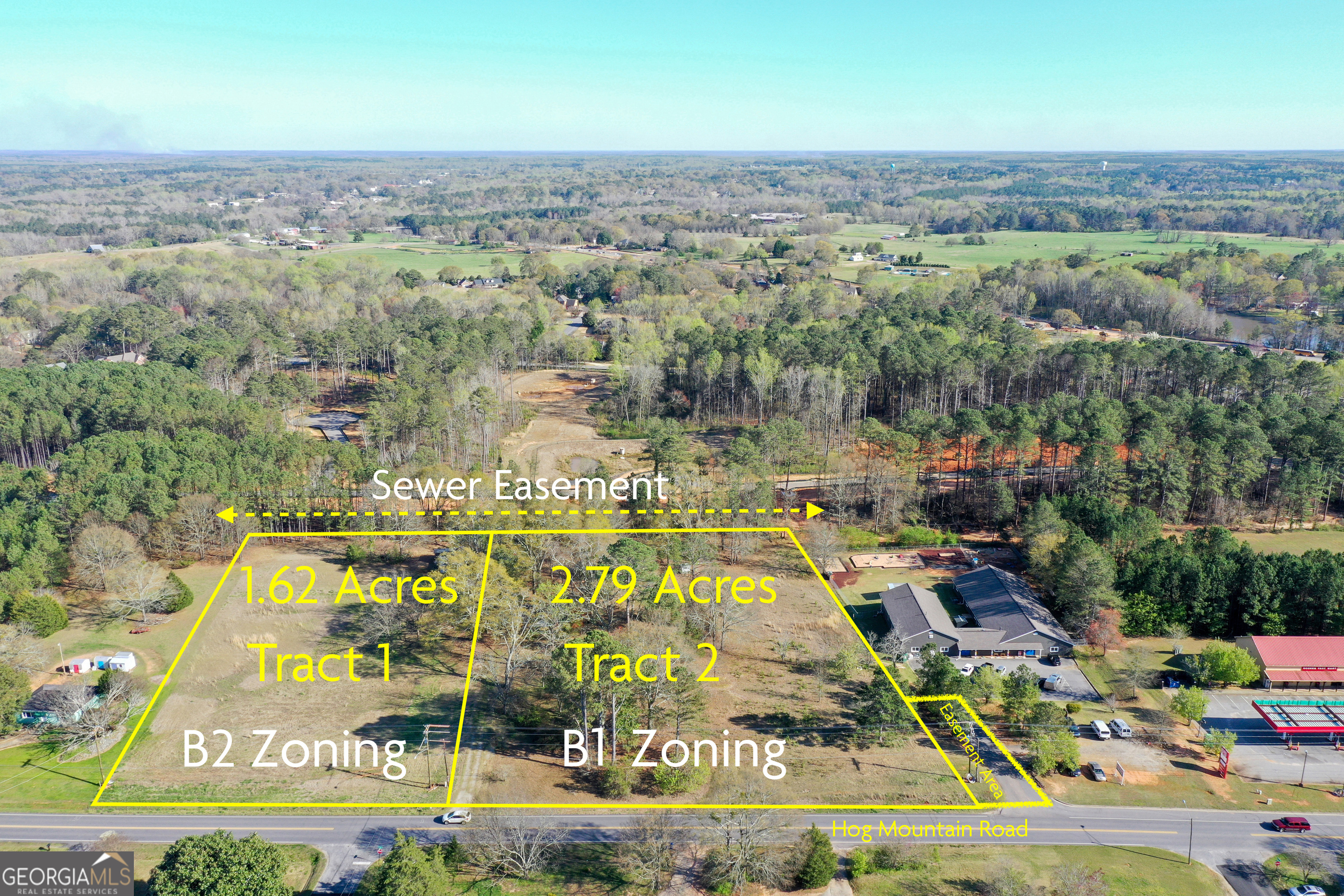 1921 Hog Mountain Road Watkinsville, GA 30677 - Photo 9 of 9 an aerial view of residential houses with outdoor space