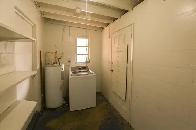 a view of a storage & utility room with a sink