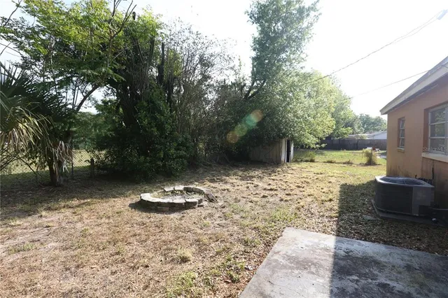 a backyard of a house with lots of green space