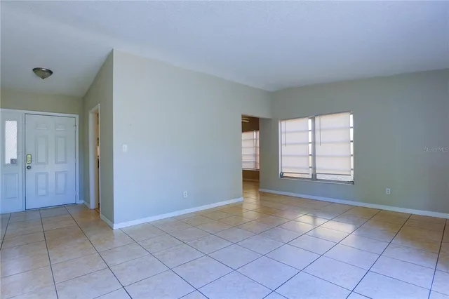 a view of an empty room with a window
