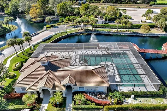 a aerial view of a house with a lake view