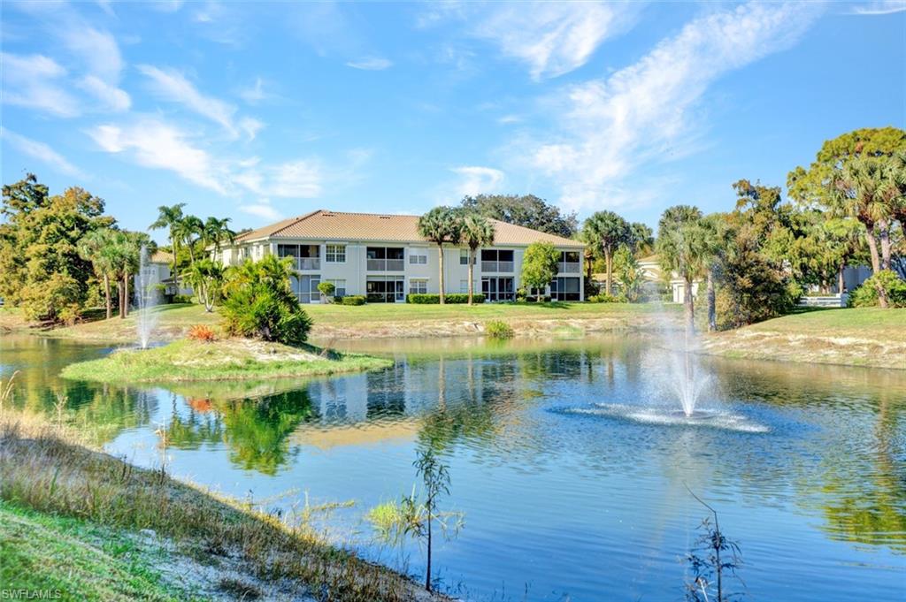 6883 Redbay Park Road, Unit 102 Naples, FL 34109 - Photo 2 of 22 a view of swimming pool with outdoor seating